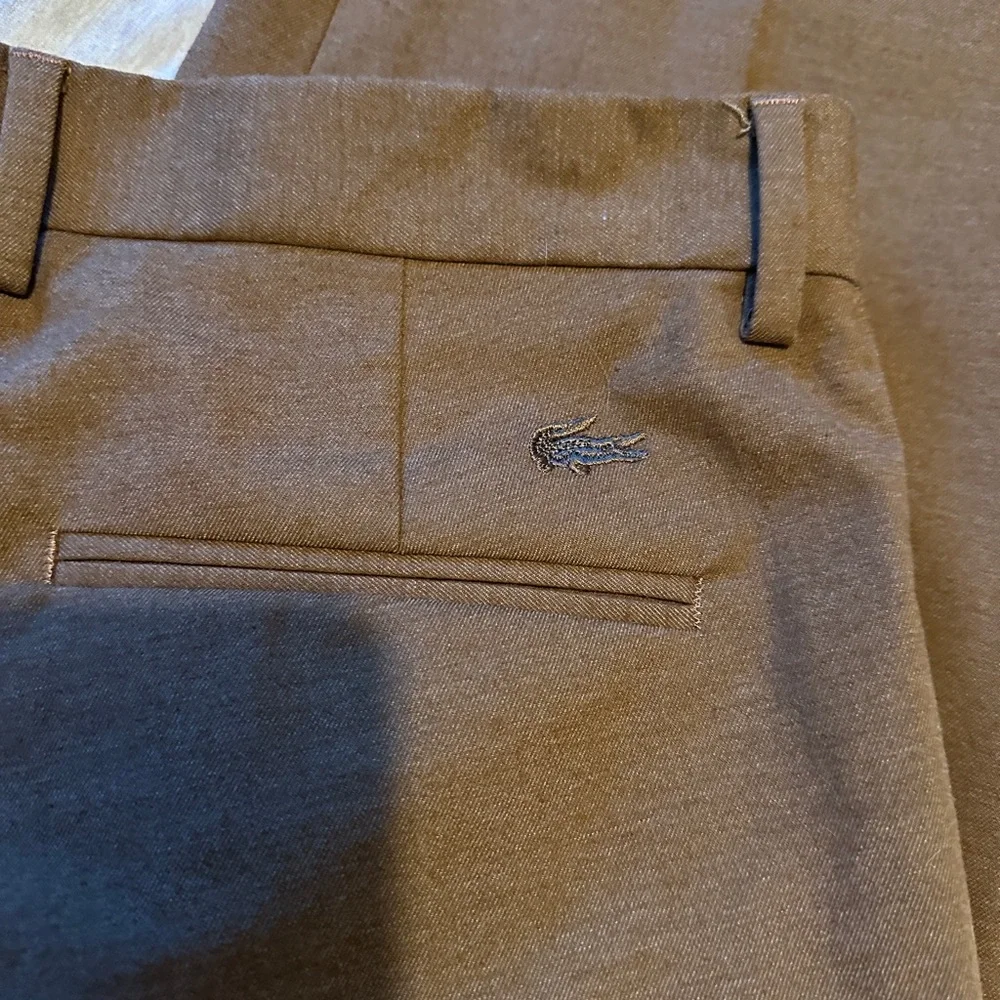Lacoste beautiful Brown slacks to dress up or wear as chinos. - Picture 1 of 4